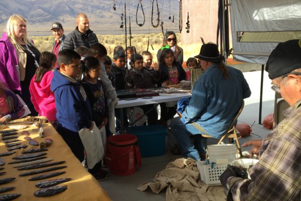Onlookers watching a flint knapping presentation at Wanapum Heritage Center Archaeology Days
